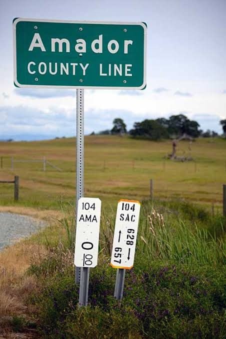 Amador County line road sign on Highway 104